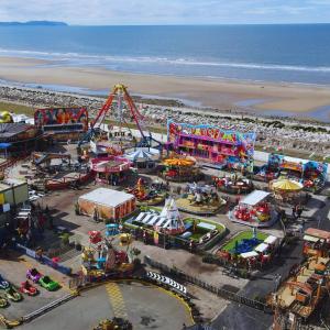 an aerial view of an amusement park on the beach at CJ Coastal Getaway #1 in Abergele