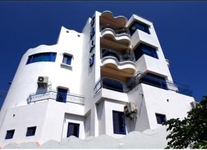 a white building with balconies on top of it at Fuyue Sea View B&B in Taitung City