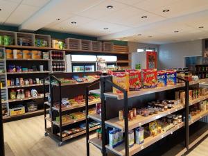 a store filled with shelves filled with food at Ostseeferienpark Walkyrien in Schashagen