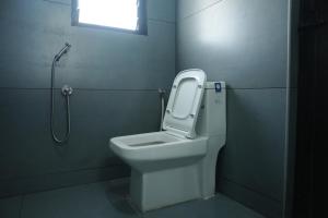 a bathroom with a toilet and a shower at Hemagiri Palace in Avati +27 photos