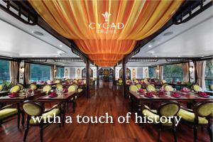 a dining car of a train with a touch of history at Cycad cruise in Ha Long