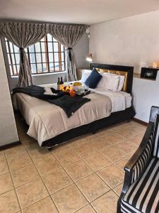 a bedroom with a bed with a tray of food on it at Ui Views in Margate +125 photos