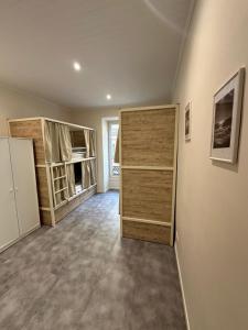 an empty room with two closets and a door at HOSTEL MEYERBEER - Rooms and Apartments in Nice +3 photos