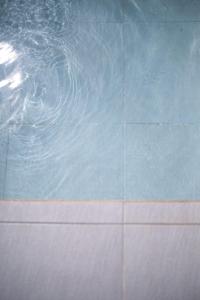 a pool of water with ripples in it at La La Villas in Pulau Pototogat