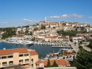 a town with a marina with boats in the water at Casa di Rose in Vrsar