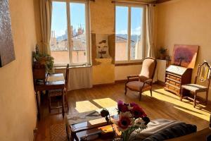 a living room with a view of a city at amazing view appartment in Lyon