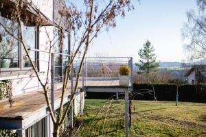 a porch of a house with a plant on it at HeartArt in Bad Münstereifel +20 photos