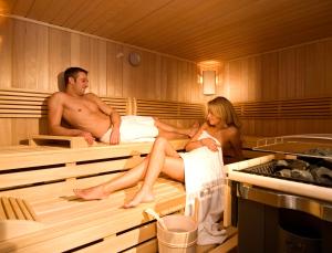 a man and a woman sitting in a bathtub at Alpenstern in Ischgl