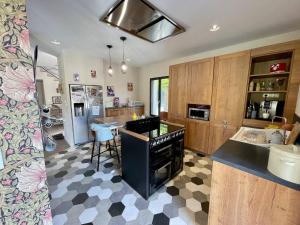 a kitchen with a counter and a stove top oven at Tardif in Vitré