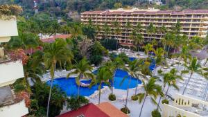 an aerial view of a resort with palm trees at Barceló Puerto Vallarta - All Inclusive in Puerto Vallarta +148 photos
