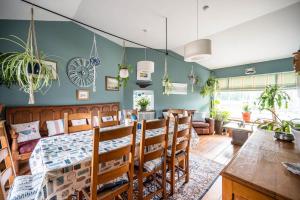 a dining room with a table and chairs at The Old Bakery, Wrentham in Wrentham