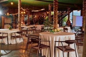 a banquet hall with tables and chairs and lights at Hotel Palmazul - Viña del Mar in Omoa
