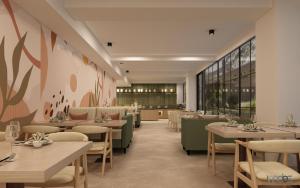 a restaurant with tables and chairs and a cafeteria at Ginger Hyderabad Genome Valley in Turkapally