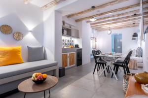 a living room with a couch and a table at Aelia Suites in Adamantas
