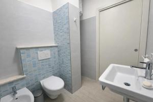 a bathroom with a toilet and a sink and a shower at Casa Sveva al Cavo in Cavo