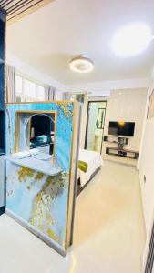 a bedroom with a room with a bed and a fireplace at HS Miracle View in Hulhumale