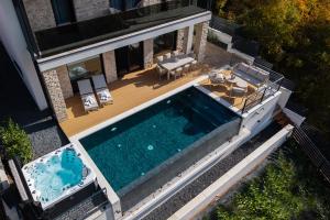 an overhead view of a swimming pool on a house at Villa Slowave in Balatonalmádi