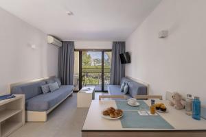 a living room with a couch and a table at Apartamentos Casa Vida in Santa Ponsa
