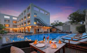 an image of a hotel with a swimming pool at The Retreat in Agra
