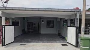 an open garage with a gate in a building at raub homesty in Raub