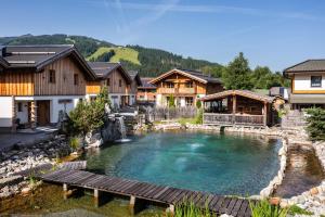 a large swimming pool in the middle of a house at Sieglhub Chalets - Appartements - Hotel in Flachau