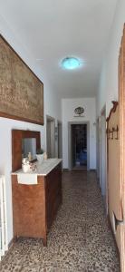 a large bathroom with a sink and a hallway at Stella Bianca in Giulianova +21 photos