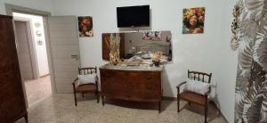 a room with a wooden dresser with a mirror at Stella Bianca in Giulianova