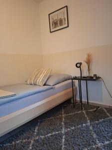 a bed with a table in a room at Restaurant Zur Linde in Bergheim +7 photos