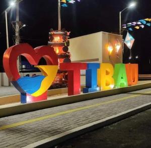a sign that says i heart berlin at night at Chalés de Tibau in Tibau
