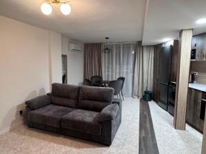 a living room with a couch and a table at Araya Apartments in Benidorm