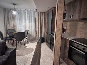a kitchen and dining room with a table and chairs at Araya Apartments in Benidorm