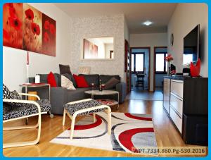 a living room with a couch and a table at Apartament Aga Świnoujście in Świnoujście