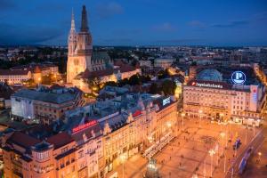 an aerial view of a city at night at Apartment History in Zagreb