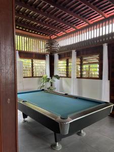 a billiard room with a pool table in it at KAZ DIBWA Beach House in Glacis