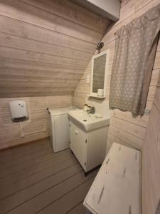 a small bathroom with a sink and a toilet at Maisonnette à Saint Valéry Sur Somme in Saint-Valéry-sur-Somme +32 photos