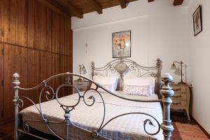 a bedroom with a metal bed in a room at The Retreat in Ierapetra +18 photos