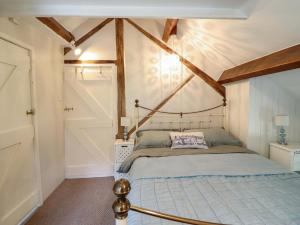 a bedroom with a bed in a room at Millers Loft in Llanrwst