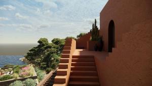 a staircase leading up to a building with cactus at Nômade Temple Ibiza - New Opening in Portinatx