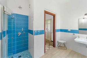a bathroom with a shower and a sink at Luxar Suites & Apartments in Assemini +123 photos