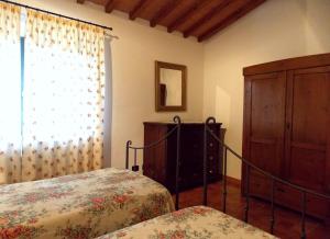 A bed or beds in a room at Villa Santa Maria a Bovino
