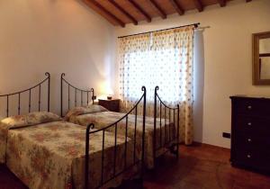 A bed or beds in a room at Villa Santa Maria a Bovino