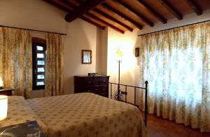 A bed or beds in a room at Villa Santa Maria a Bovino