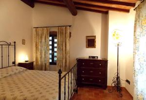 A bed or beds in a room at Villa Santa Maria a Bovino