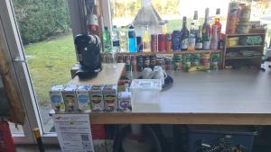 a counter in a store with many items on it at Quiet caravan in nature on Mur cycle path in Feldkirchen bei Graz