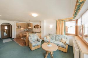 a living room with a couch and a table at Pension Johannes in Bach