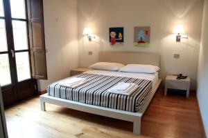 A bed or beds in a room at Spa Resort Fonte Alla Lepre