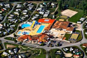 an aerial view of a large house with a pool at Camping Les Charmettes-Mobile Home Vacances in Les Mathes