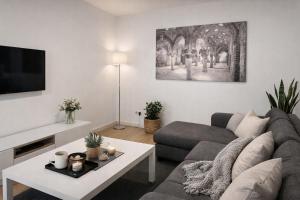a living room with a couch and a table at Gav Remedios 20 in Ronda