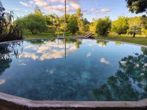 a large pool of water in a park at Quinta San Miguel in Concordia