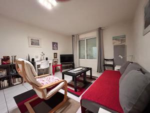 a living room with a couch and a table at 31 Bd De Launay in Nantes